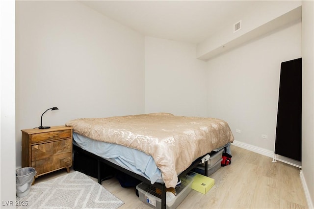 200 W Sahara Ave Unit 910, Las Vegas, NV 89102 - bedroom with wood finished floors and baseboards
