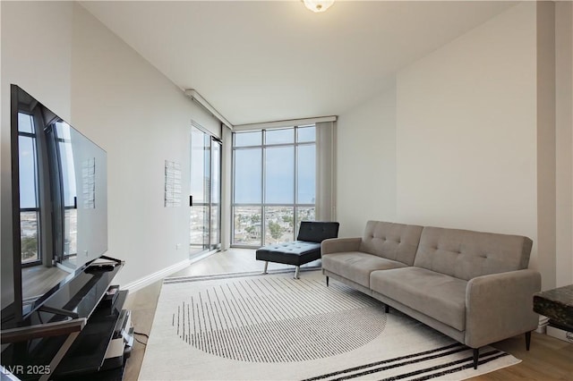 200 W Sahara Ave Unit 910, Las Vegas, NV 89102 - living area with wood finished floors, floor to ceiling windows, and baseboards