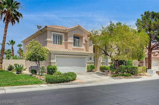 301 Lakewood Garden Dr, Las Vegas, NV 89148 - mediterranean / spanish house featuring a tiled roof, an attached garage, stucco siding, and concrete driveway