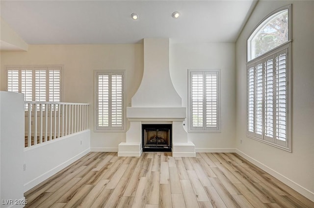 301 Lakewood Garden Dr, Las Vegas, NV 89148 - unfurnished living room featuring wood finished floors, a large fireplace, baseboards, and recessed lighting