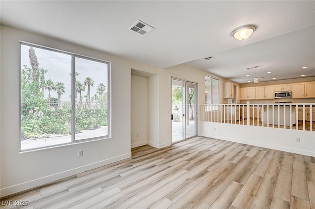 301 Lakewood Garden Dr, Las Vegas, NV 89148 - unfurnished living room with light wood-type flooring, baseboards, and recessed lighting