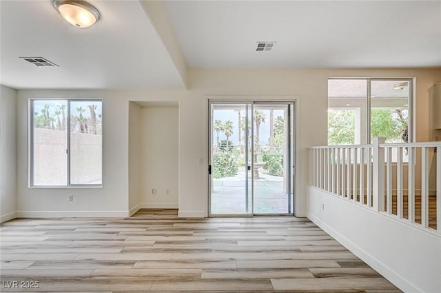 301 Lakewood Garden Dr, Las Vegas, NV 89148 - unfurnished room with light wood-type flooring, healthy amount of natural light, and baseboards