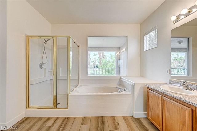 301 Lakewood Garden Dr, Las Vegas, NV 89148 - full bath with vanity, healthy amount of natural light, wood finished floors, and a stall shower
