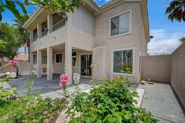 301 Lakewood Garden Dr, Las Vegas, NV 89148 - rear view of property featuring stucco siding and a patio