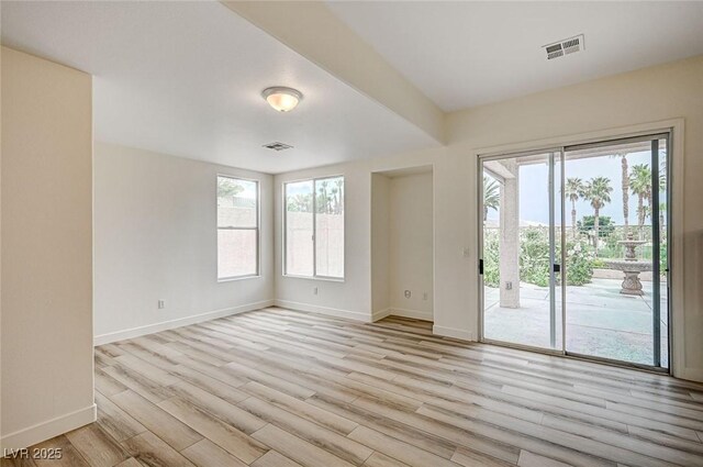 301 Lakewood Garden Dr, Las Vegas, NV 89148 - empty room featuring healthy amount of natural light, baseboards, and light wood-style flooring