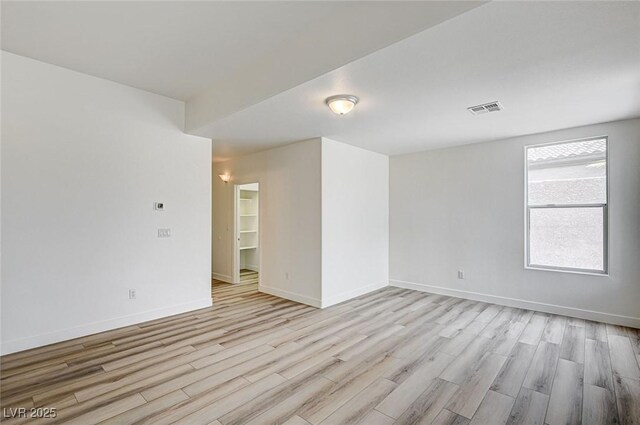 301 Lakewood Garden Dr, Las Vegas, NV 89148 - spare room featuring light wood-style floors and baseboards