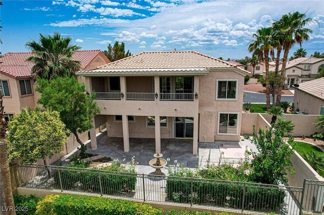 301 Lakewood Garden Dr, Las Vegas, NV 89148 - rear view of house featuring a tiled roof, stucco siding, a patio area, and a fenced backyard