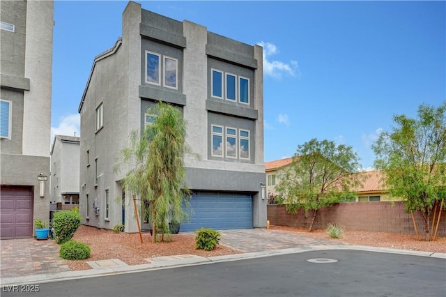 7756 Seville Estates Ct, Las Vegas, NV 89113 - view of front of property with stucco siding, a garage, and driveway