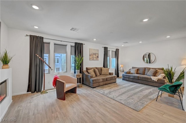 7756 Seville Estates Ct, Las Vegas, NV 89113 - living room featuring light wood finished floors, recessed lighting, and baseboards