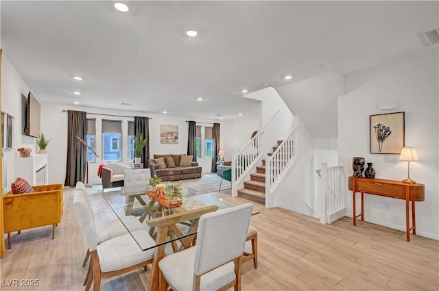 7756 Seville Estates Ct, Las Vegas, NV 89113 - dining space with light wood-style floors, stairway, and recessed lighting