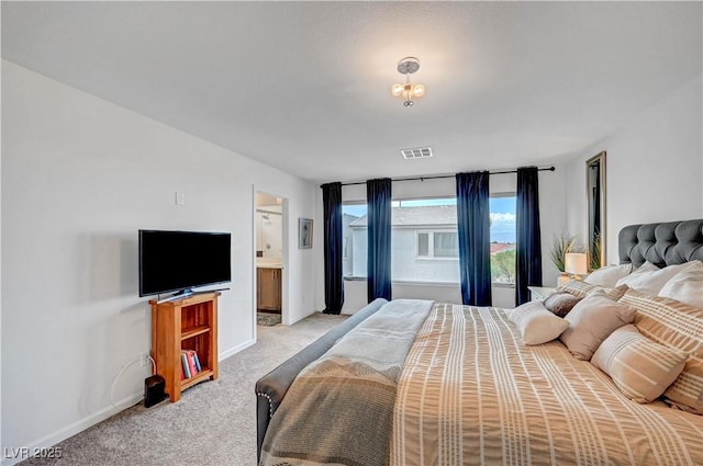 7756 Seville Estates Ct, Las Vegas, NV 89113 - bedroom featuring light carpet, baseboards, and ensuite bath