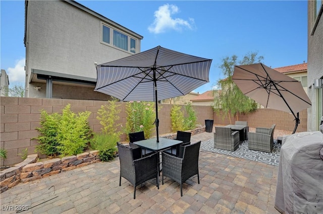 7756 Seville Estates Ct, Las Vegas, NV 89113 - fenced backyard featuring outdoor dining space, a patio, and an outdoor living space