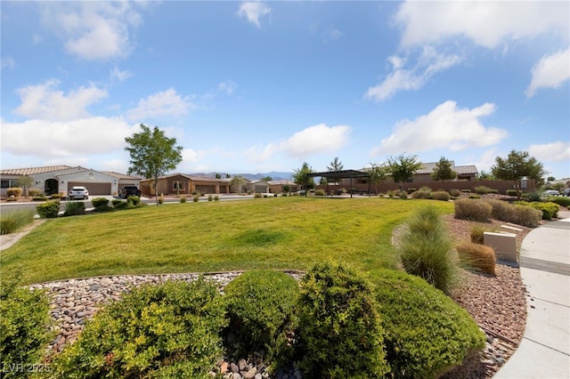 5375 E Ln Campana Dr, Pahrump, NV 89061 - view of grassy yard with a residential view and a garage