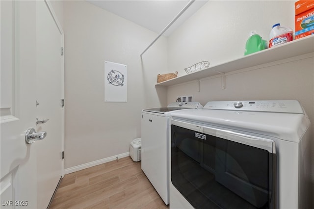 5375 E Ln Campana Dr, Pahrump, NV 89061 - laundry area with washing machine and dryer and light wood finished floors