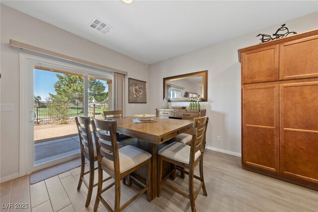 5375 E Ln Campana Dr, Pahrump, NV 89061 - dining room featuring baseboards and light wood-style floors