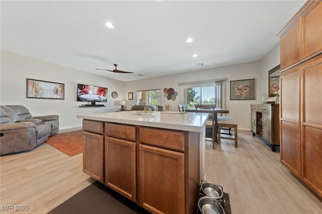 5375 E Ln Campana Dr, Pahrump, NV 89061 - kitchen featuring open floor plan, light wood-style floors, recessed lighting, and light countertops
