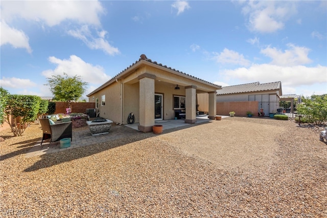 5375 E Ln Campana Dr, Pahrump, NV 89061 - rear view of house with a patio, stucco siding, a fenced backyard, and a tile roof