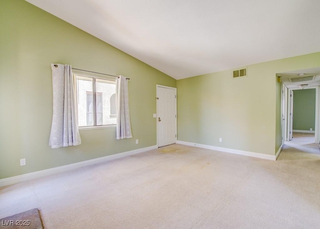 2212 Sunfish Dr Unit C, Henderson, NV 89014 - spare room featuring light carpet, lofted ceiling, and baseboards