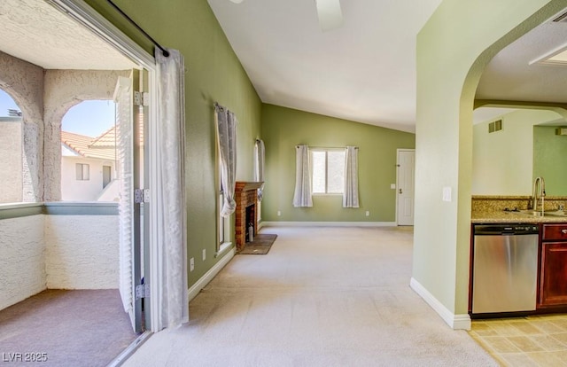 2212 Sunfish Dr Unit C, Henderson, NV 89014 - hallway with a sink, arched walkways, vaulted ceiling, light colored carpet, and baseboards