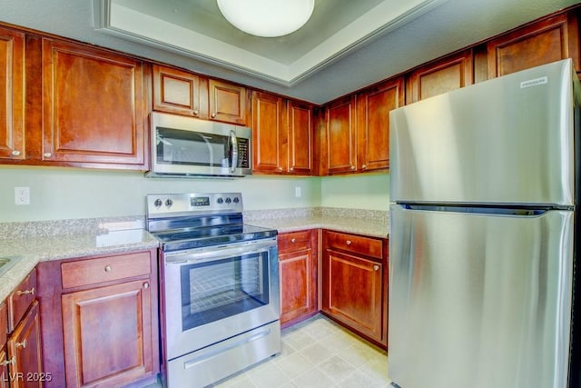 2212 Sunfish Dr Unit C, Henderson, NV 89014 - kitchen featuring appliances with stainless steel finishes and a raised ceiling