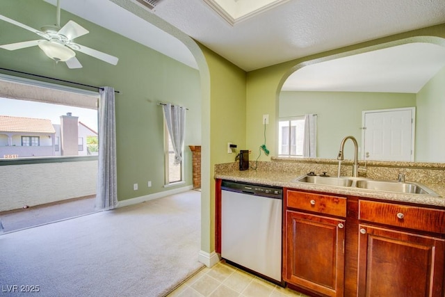 2212 Sunfish Dr Unit C, Henderson, NV 89014 - kitchen featuring dishwasher, a sink, arched walkways, and healthy amount of natural light