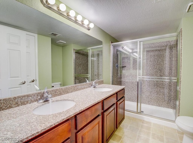 2212 Sunfish Dr Unit C, Henderson, NV 89014 - full bath featuring toilet, a textured ceiling, double vanity, and a stall shower