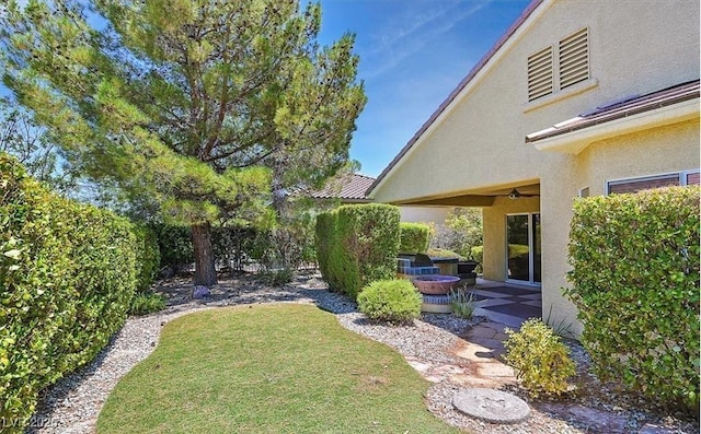 1941 Williamsport St, Henderson, NV 89052 - view of grassy yard featuring an outdoor fire pit and a patio