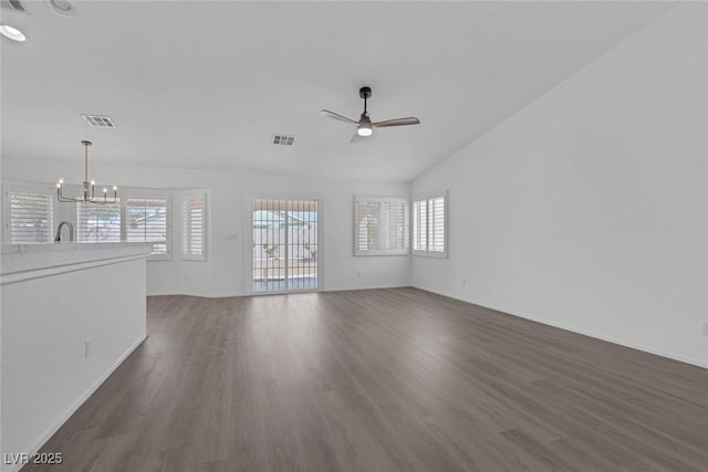 5808 Spinnaker Reach Ave, Las Vegas, NV 89130 - unfurnished living room with ceiling fan, dark wood-type flooring, baseboards, a chandelier, and a sink