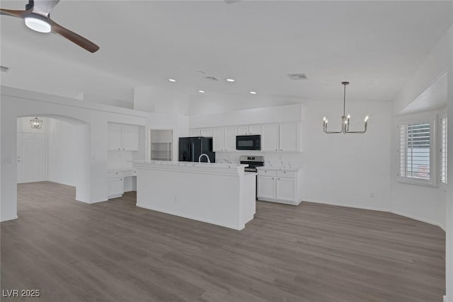 5808 Spinnaker Reach Ave, Las Vegas, NV 89130 - unfurnished living room with a chandelier, dark wood-type flooring, lofted ceiling, ceiling fan, and recessed lighting
