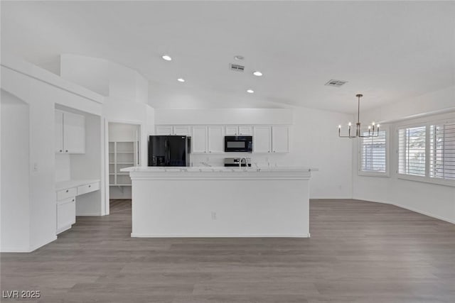 5808 Spinnaker Reach Ave, Las Vegas, NV 89130 - kitchen featuring black appliances, a chandelier, vaulted ceiling, white cabinetry, and recessed lighting