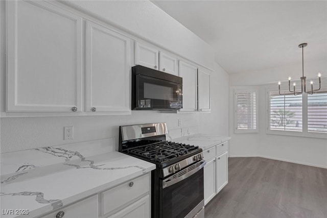 5808 Spinnaker Reach Ave, Las Vegas, NV 89130 - kitchen with black microwave, gas stove, a chandelier, white cabinetry, and light stone counters
