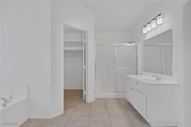 5808 Spinnaker Reach Ave, Las Vegas, NV 89130 - bathroom with a shower stall, tile patterned flooring, vanity, a walk in closet, and a bath