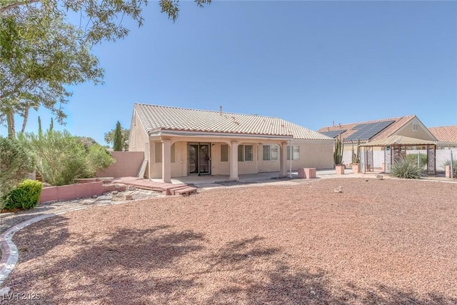 5808 Spinnaker Reach Ave, Las Vegas, NV 89130 - back of property featuring a patio area, a tile roof, and stucco siding