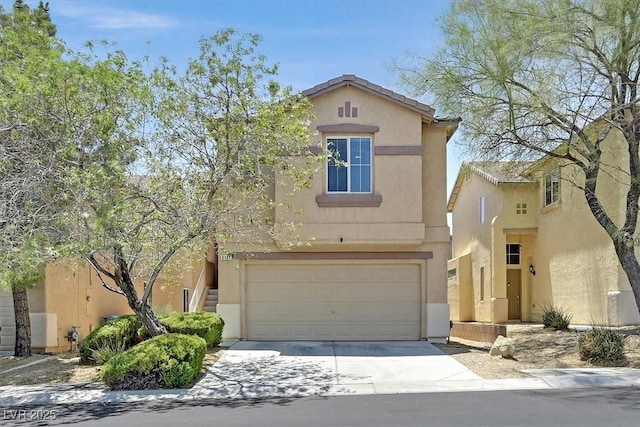 9105 White Eyes Ave, Las Vegas, NV 89143 - view of front of house featuring concrete driveway, stucco siding, and a garage