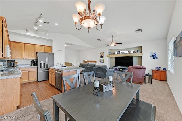 9105 White Eyes Ave, Las Vegas, NV 89143 - dining space with vaulted ceiling, a ceiling fan, and a chandelier