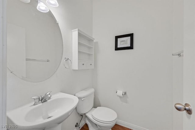 9105 White Eyes Ave, Las Vegas, NV 89143 - bathroom featuring a sink and wood finished floors