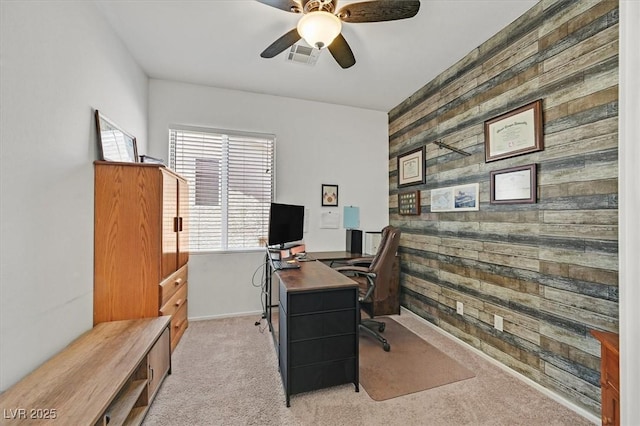 9105 White Eyes Ave, Las Vegas, NV 89143 - home office with an accent wall, wood walls, carpet, and ceiling fan