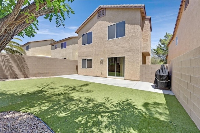 9105 White Eyes Ave, Las Vegas, NV 89143 - rear view of house featuring a fenced backyard, stucco siding, and a patio area