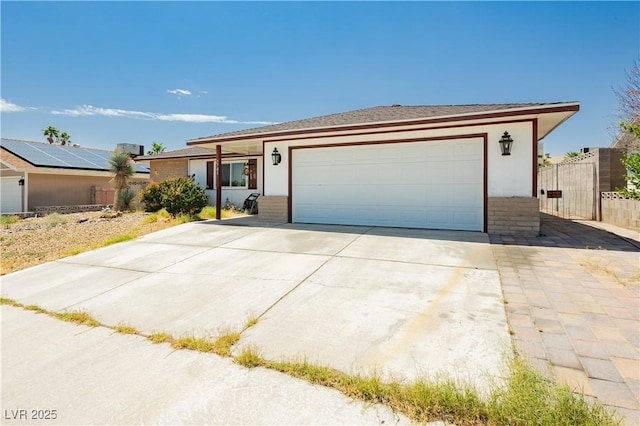 7701 Pheasant Ln, Las Vegas, NV 89145 - ranch-style house with a garage, concrete driveway, and brick siding