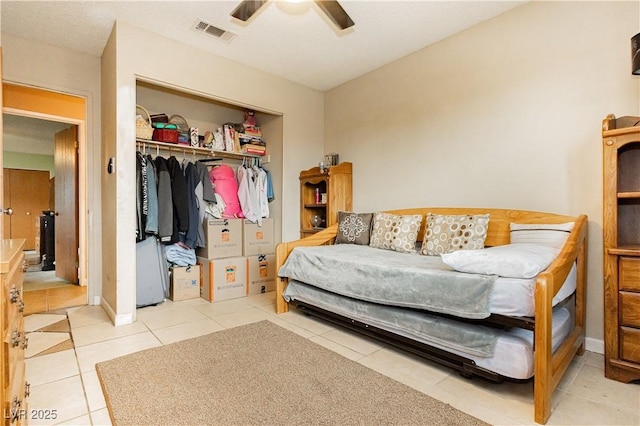 7701 Pheasant Ln, Las Vegas, NV 89145 - bedroom with tile patterned floors, a closet, and a ceiling fan