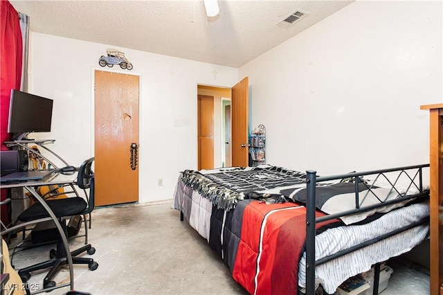 7701 Pheasant Ln, Las Vegas, NV 89145 - bedroom featuring concrete floors and a textured ceiling