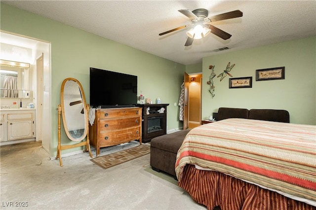 7701 Pheasant Ln, Las Vegas, NV 89145 - bedroom featuring baseboards, ensuite bath, and a ceiling fan