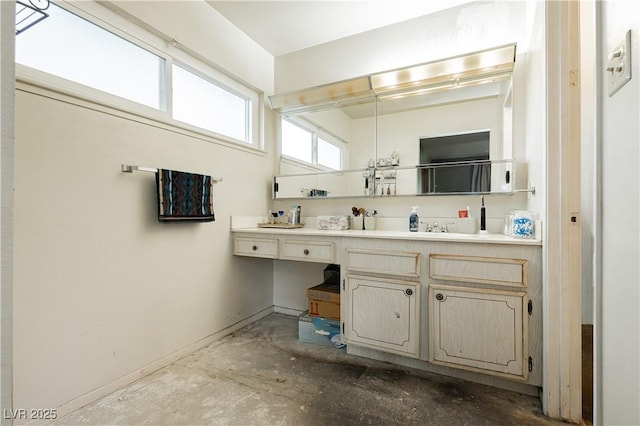 7701 Pheasant Ln, Las Vegas, NV 89145 - full bath featuring double vanity, concrete floors, and baseboards