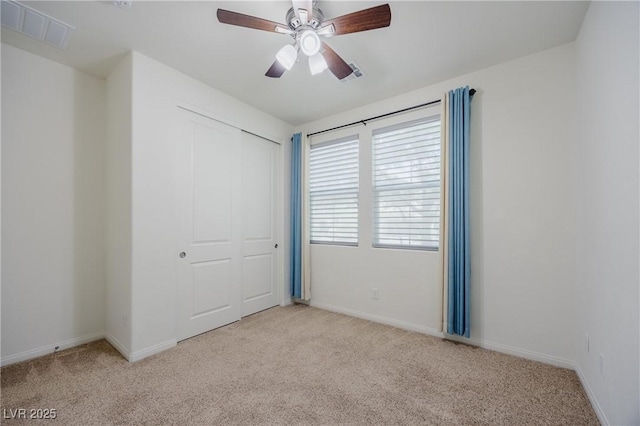 6403 Ava Ridge Ave, Las Vegas, NV 89141 - unfurnished bedroom featuring carpet flooring, a closet, baseboards, and a ceiling fan