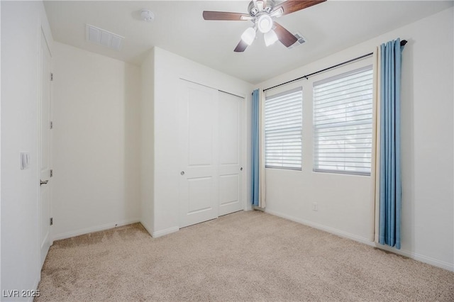 6403 Ava Ridge Ave, Las Vegas, NV 89141 - unfurnished bedroom with carpet flooring, a closet, baseboards, and a ceiling fan