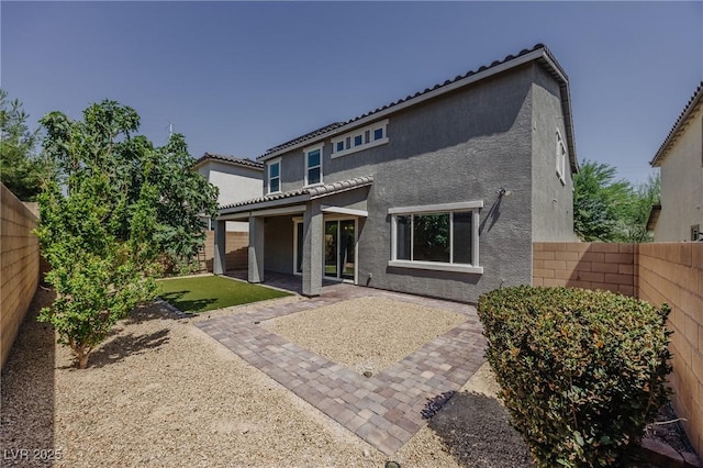 6403 Ava Ridge Ave, Las Vegas, NV 89141 - back of house with stucco siding, a fenced backyard, a patio, and a tile roof