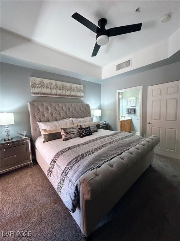 23 E Agate Ave Unit 301, Las Vegas, NV 89123 - carpeted bedroom with ensuite bathroom and a ceiling fan