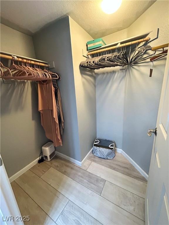 23 E Agate Ave Unit 301, Las Vegas, NV 89123 - walk in closet with light wood-style floors