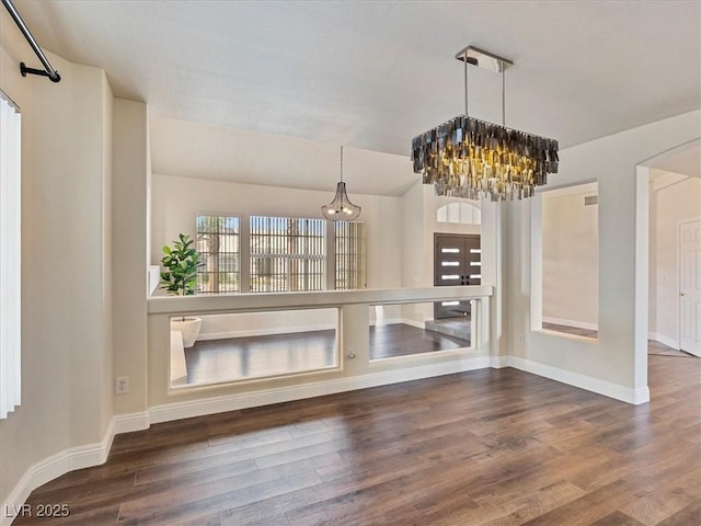 6639 Tranquil Seas Ct, Las Vegas, NV 89139 - unfurnished living room with a chandelier, baseboards, and wood finished floors