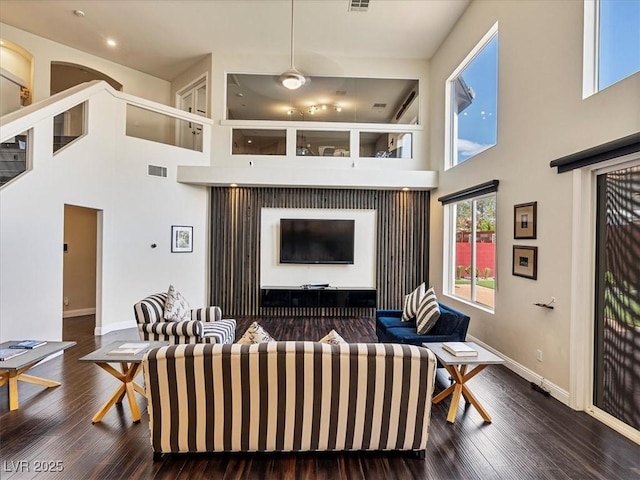 6639 Tranquil Seas Ct, Las Vegas, NV 89139 - living room featuring a towering ceiling, wood finished floors, baseboards, recessed lighting, and a ceiling fan